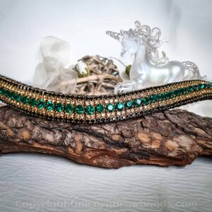 Emerald Envy Browband featuring rich emerald green crystals set amidst gold and jet black accents for a regal equestrian look