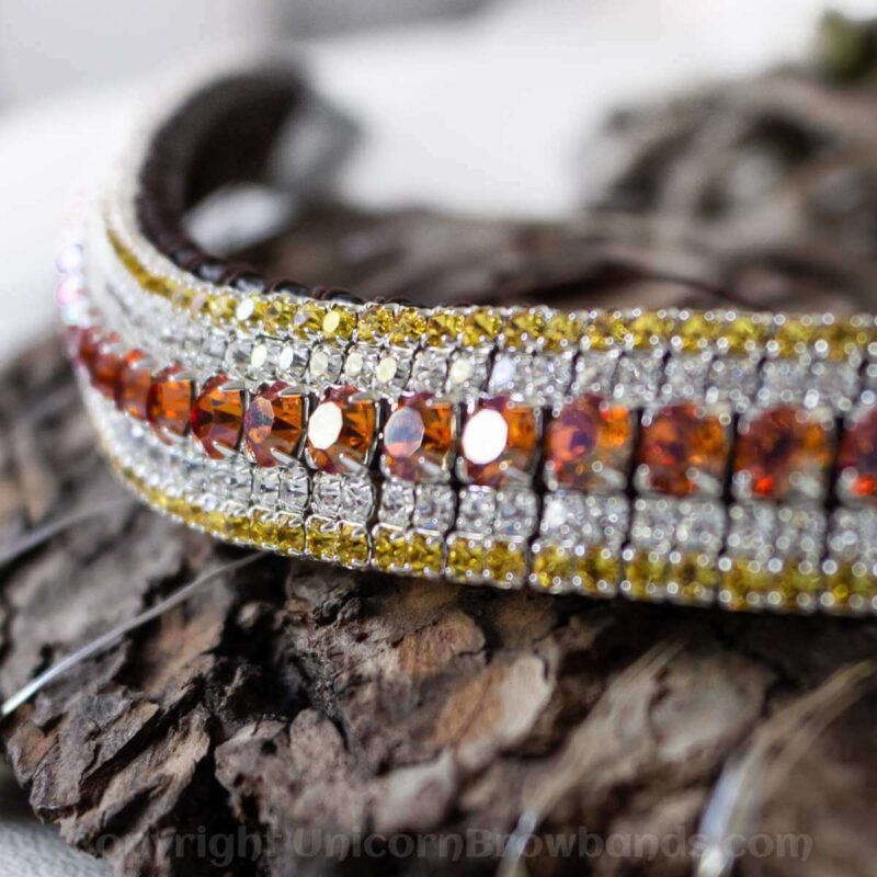 Golden lava iridescent orange and purple crystals in this luxury crystal browband by Unicorn Browbands. Edged with yummy rich, golden yellow and teamed with classy clear Preciosa crystals on a hand stitched buttery soft English sedwicks leather browband.