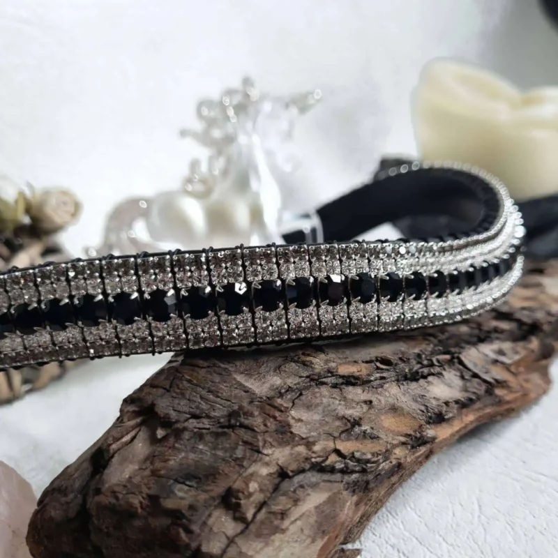 Elegant Crystal Browband with Jet Black, Clear, and Black Diamond Crystals: A detailed view of the handcrafted browband showcasing its shimmering black, clear, and black diamond crystals set against high-quality black leather.