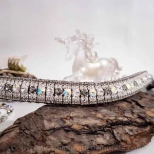 Swarovski Crystal Browband displayed on a log, showcasing its dazzling 5-row design with Swarovski Rivoli crystals in Black Diamond and Aurora Borealis. Special Edition Browband.