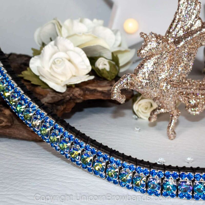 A bright blue browband on a white background featuring tree bark and white flowers